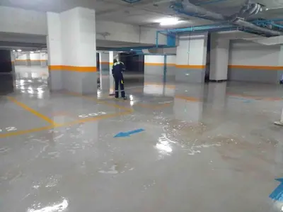 a man is standing in a flooded parking lot at Perfect stay at CFC near Aeria Mall in Casablanca