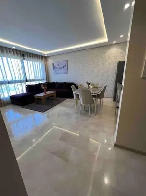 a living room with a couch and a table at Perfect stay at CFC near Aeria Mall in Casablanca
