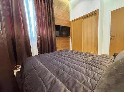 a bedroom with a large bed in a room at Corniche Casablanca- Suite Luxueuse Gold Star in Casablanca