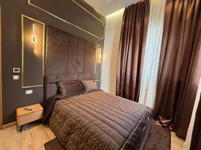 a bedroom with a large bed and a large window at Corniche Casablanca- Suite Luxueuse Gold Star in Casablanca