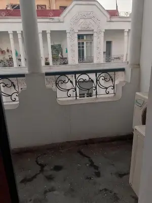 a balcony of a white building with a railing at Hôtel Volubilis in Casablanca