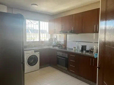 a kitchen with a washing machine and a washer at La terrasse Agdal in Rabat