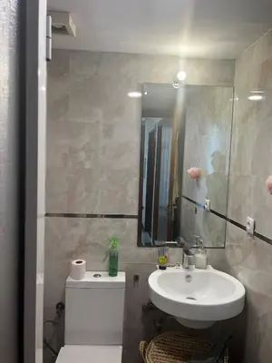 a bathroom with a sink and a mirror at La terrasse Agdal in Rabat