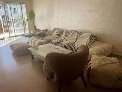 a living room with a couch and a coffee table at La terrasse Agdal in Rabat