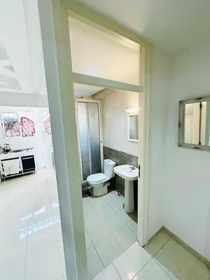 a bathroom with a toilet and a sink at ONOMSUIT-Appartement en plein centre ville RABAT in Rabat