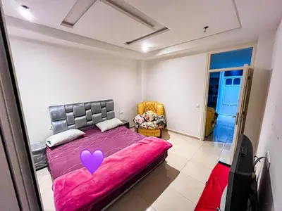 a bedroom with a pink bed with a heart on it at ONOMSUIT-Appartement en plein centre ville RABAT in Rabat