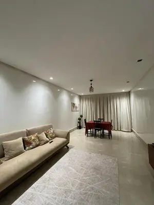 a living room with a couch and a table at 2 bedroom cozy apartment ,near CFC,in center casablanca in Casablanca