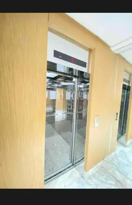 an entrance to an office building with a sliding glass door at 2 bedroom cozy apartment ,near CFC,in center casablanca in Casablanca