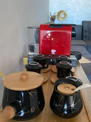 a group of drums on a table with a laptop at Cozy apartment in Mohammedia in Mohammedia