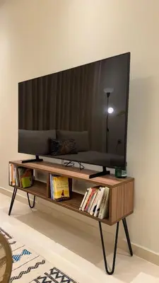 a tv sitting on top of a coffee table at Ksar Labhar City Escape in Rabat