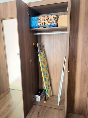 a wooden compartment with two umbrellas in it at 35 Appartement ensoleillé calme et NEUF in Casablanca