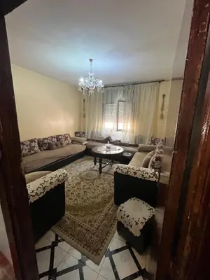 a living room with a couch and a table at Oulfa in Casablanca