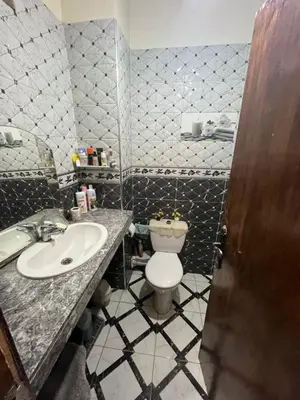 a small bathroom with a toilet and a sink at Oulfa in Casablanca