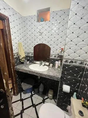 a bathroom with a sink and a toilet at Oulfa in Casablanca