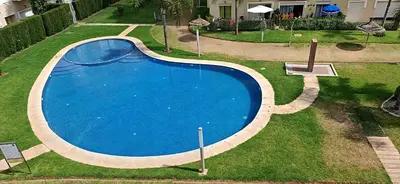 an overhead view of a blue swimming pool at Les Jardins De Bouznika GHA4 in Bouznika