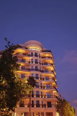a tall white building with a lot of windows at Le Square By Onomo Collection in Casablanca