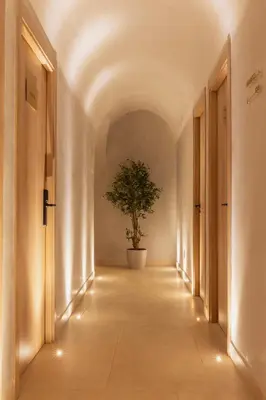 a hallway with a potted tree in the middle at Le Square By Onomo Collection in Casablanca