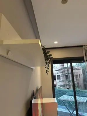 a room with a window with a view of a building at Ideal home away from home in Maarif