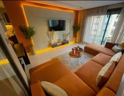 a living room with a couch and a tv at المعاريف in Casablanca