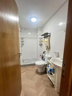 a bathroom with a toilet and a sink and a shower at Sweet appartement Boulevard de Paris à 2min du centre ville in Casablanca