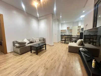 a living room with a couch and a table at Sweet appartement Boulevard de Paris à 2min du centre ville in Casablanca