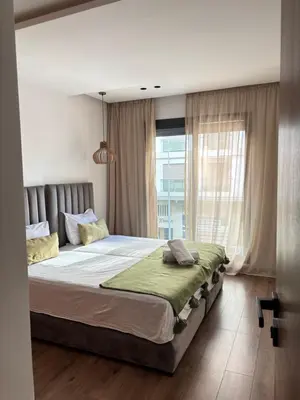 a bedroom with a large bed and a window at Modern minimaliste retreat in Maarif in Casablanca