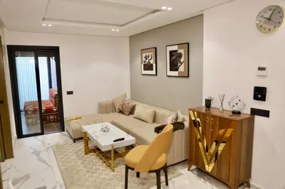 a living room with a couch and a table at Luxury apartment in Casablanca