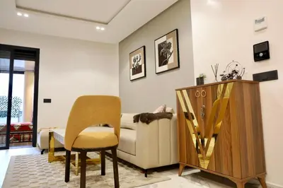 a living room with a couch and a chair at Luxury apartment in Casablanca
