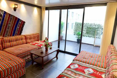 a living room with two couches and a coffee table at Luxury apartment in Casablanca