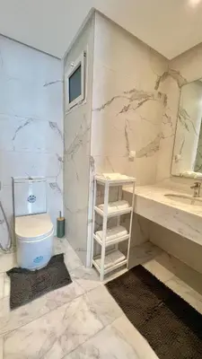 a bathroom with a toilet and a sink at N8 appartement, 3 Chambres Haut de Gamme, a Deux Pas de l Ocean et du Mall in Rabat