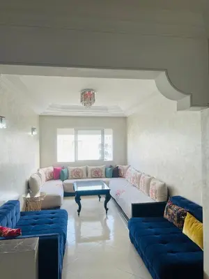 a living room with a couch and a table at Lovely 2 bedrooms Furnished Bourgogne in Casablanca