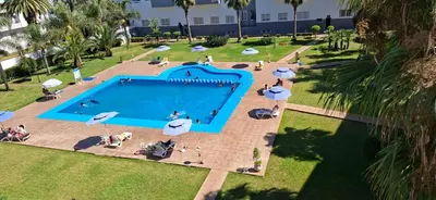 an overhead view of a swimming pool in a park at Residence la corniche d in Mohammedia
