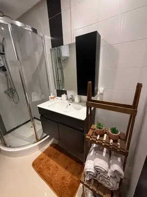 a bathroom with a sink and a shower at Apartement agdal in Rabat