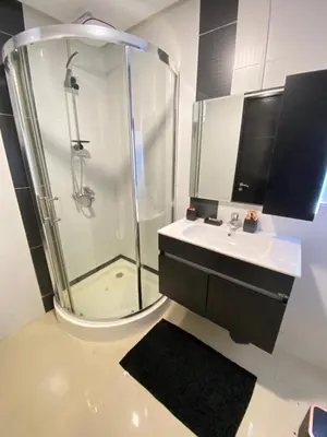 a bathroom with a shower and a sink at Apartement agdal in Rabat