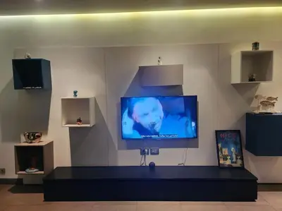 a flat screen tv on a wall in a room at Blue Anfa Place in Casablanca