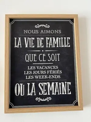 a chalkboard with a sign in a wooden frame at Blue Anfa Place in Casablanca