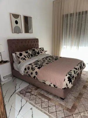 a bedroom with a bed with black and white cows at Magnificent Cozy New Luxury Condo in Prime Casablanca Location in Les Camps