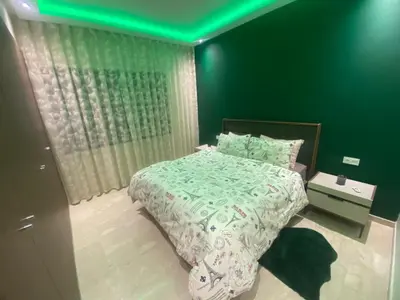 a bedroom with a bed with a green ceiling at Luxury 3 Bedroom Apt Near Park and Sea, Heated Indoor Pool, Wifi, Free Parking in Casablanca