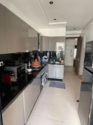 a large kitchen with stainless steel appliances at Luxury 3 Bedroom Apt Near Park and Sea, Heated Indoor Pool, Wifi, Free Parking in Casablanca