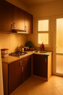 a kitchen with a stove and a sink and a window at Dar wifak in Temara