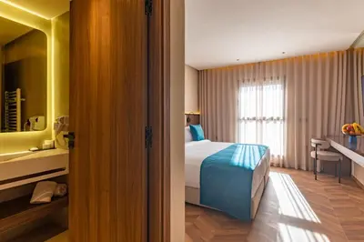 a hotel room with a bed and a window at Citadines Almaz Aparthotel Casablanca in Casablanca