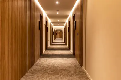 a corridor of a hotel with wooden walls and a long hallway at Citadines Almaz Aparthotel Casablanca in Casablanca