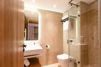 a bathroom with a toilet and a sink at Citadines Almaz Aparthotel Casablanca in Casablanca