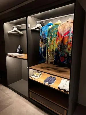 a walk in closet with a bunch of clothes and shoes at Sunset Lover in Casablanca-Port