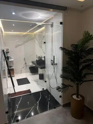 a bathroom with a shower and a potted plant at Sunset Lover in Casablanca-Port