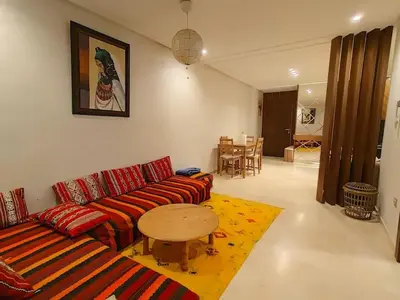 a living room with a couch and a table at شقة فاخرة ومريحة في قلب الرباط in Rabat