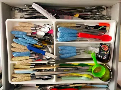 a drawer filled with lots of different colored utensils at شقة فاخرة ومريحة في قلب الرباط in Rabat