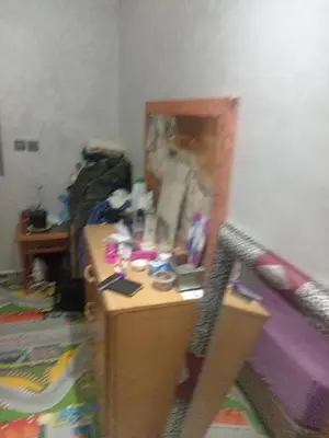 a messy room with a desk and a bed at Basatin al firdaws in Ben Yakhlef
