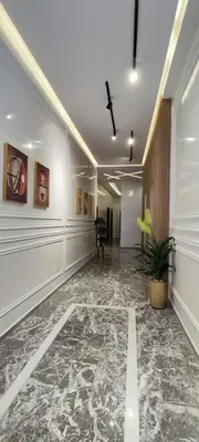 an empty hallway with a plant in a building at Résidence Acacias Casablanca in Casablanca