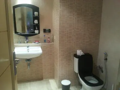 a bathroom with a toilet and a sink at Suite Meublée à Nouaceur in Nouaceur